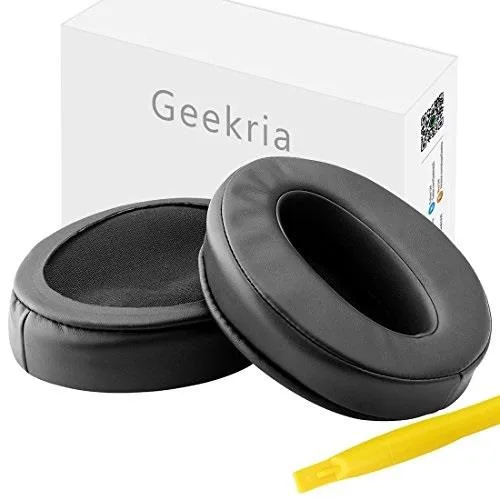 Pair of black oval earpads with mesh centre, shown flat