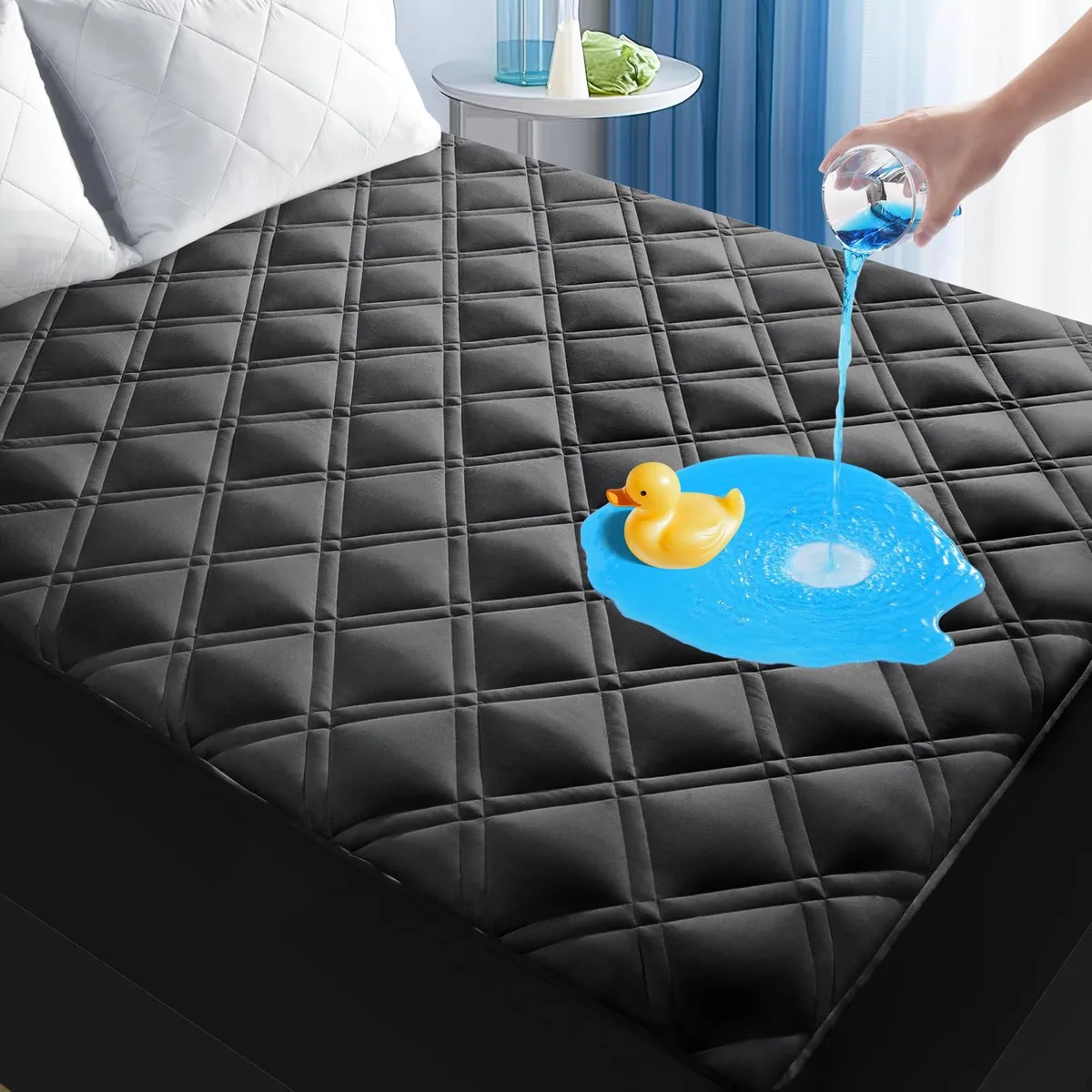 Black quilted king mattress protector with deep pocket skirt visible on flat surface
