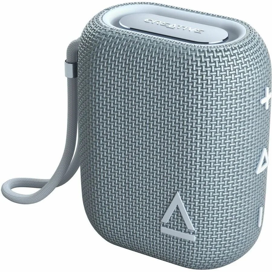 Grey rectangular portable speaker with rounded edges and fabric grille