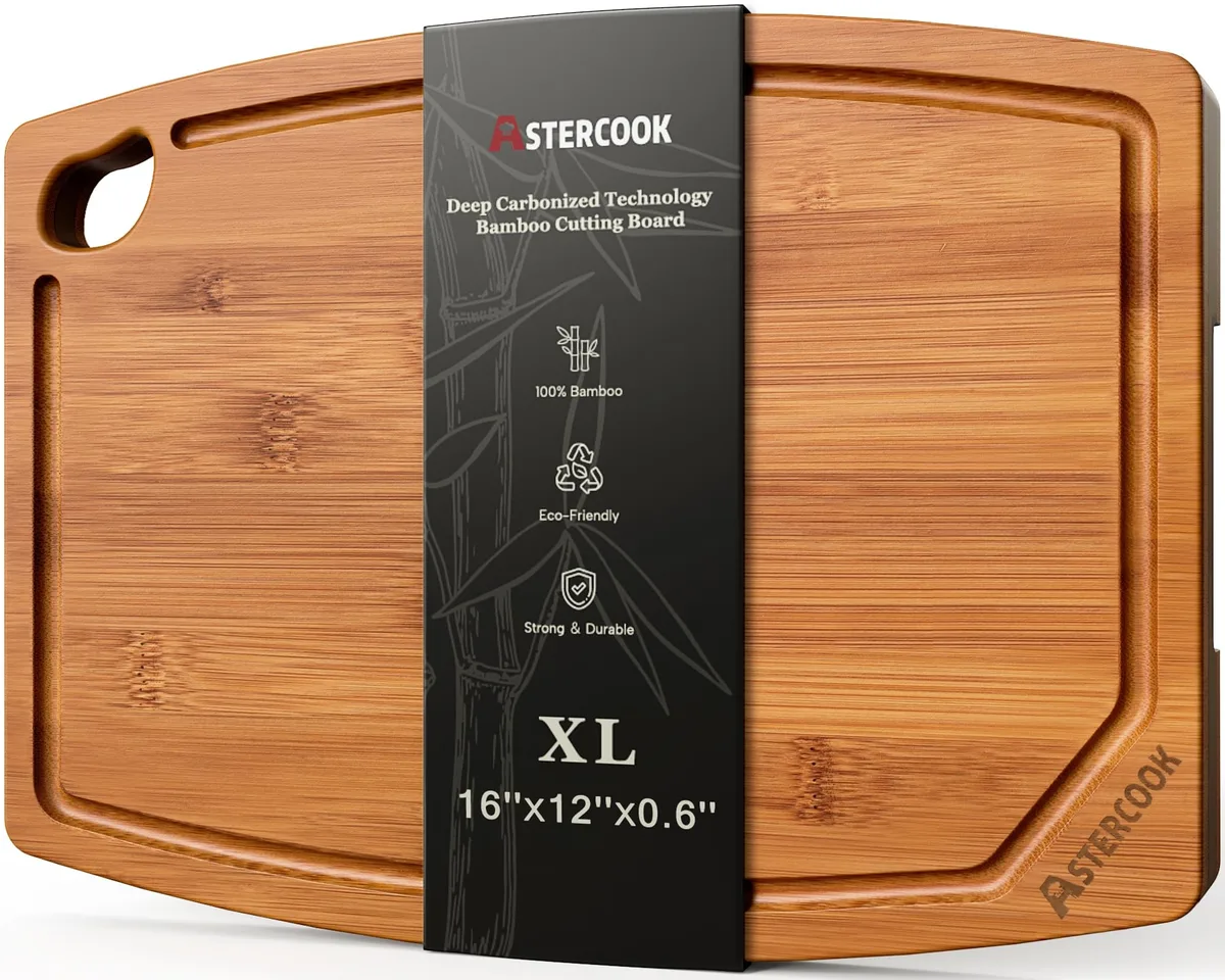 Rectangular bamboo cutting board with dark carbonized finish, juice groove and handle cutout