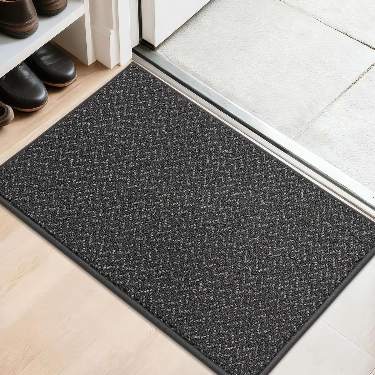 Rectangular dark grey doormat with striped pattern, low pile, non-slip backing