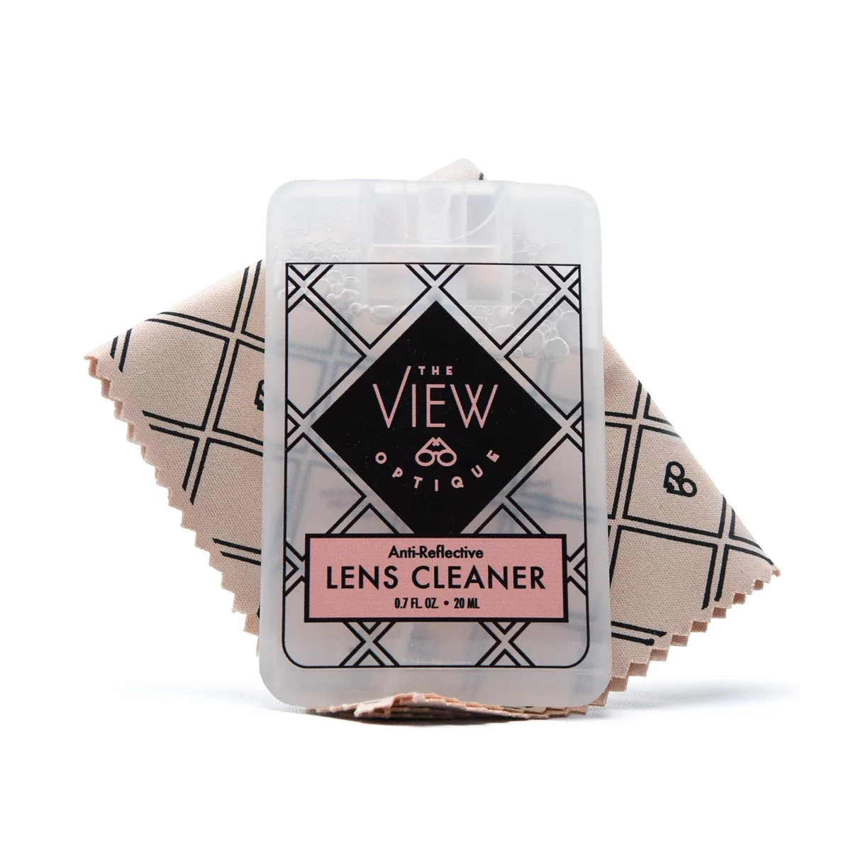 Small square spray bottle and folded microfiber cloth