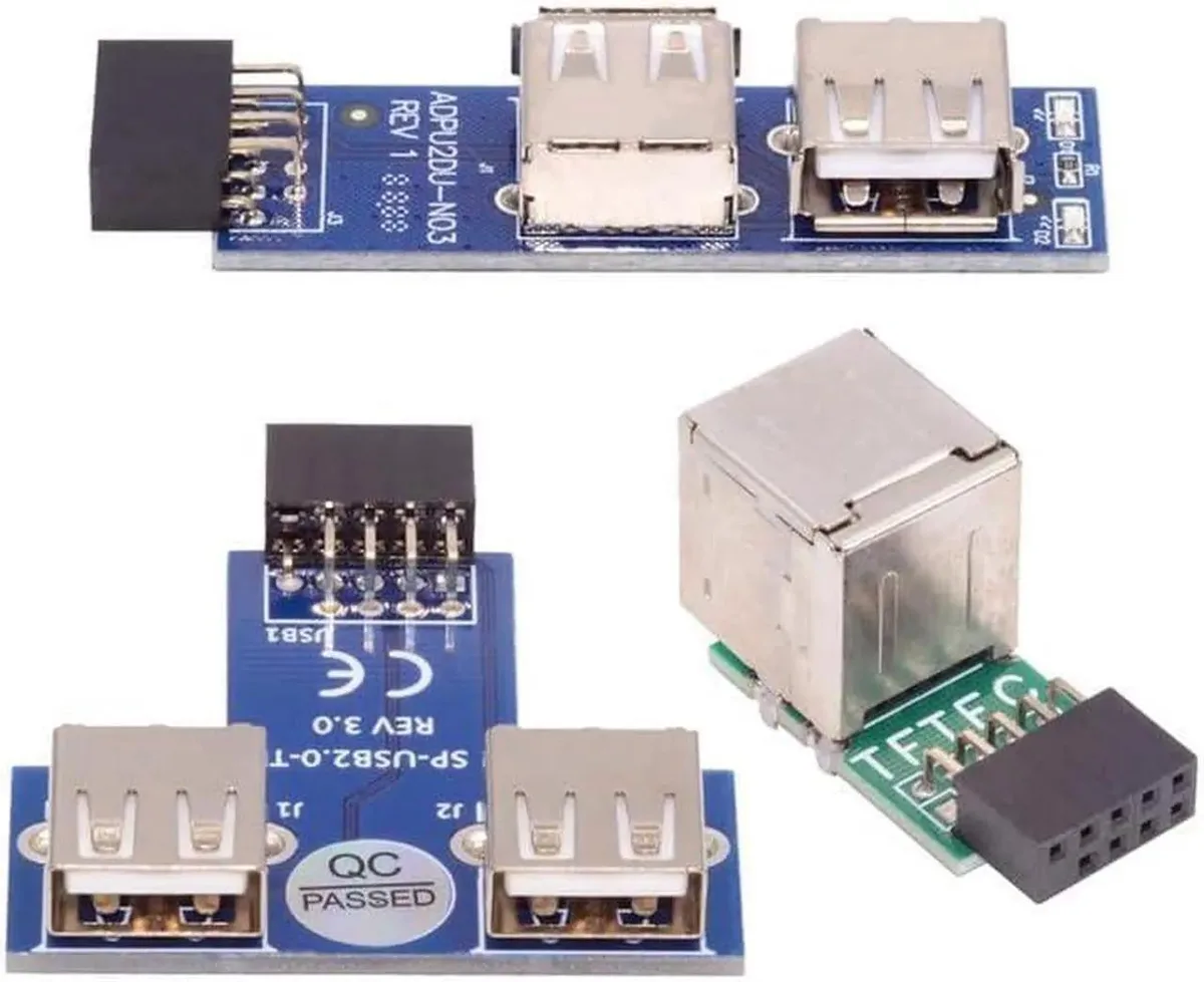 Three small circuit boards with USB-A ports and 9-pin headers, mixed vertical and horizontal orientation
