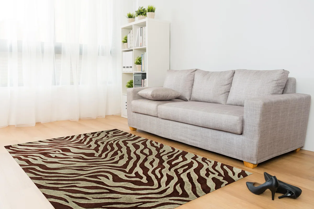 Hand-tufted wool rug in green with animal pelt pattern, cotton backing
