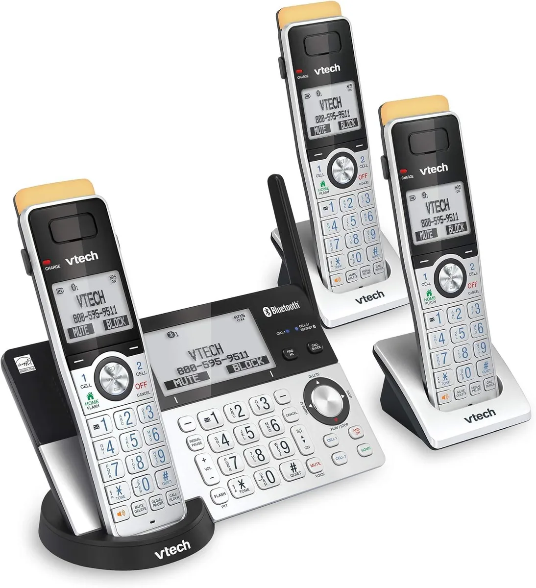 White cordless phone base with three handsets in charging cradles, large backlit screens and keypads visible