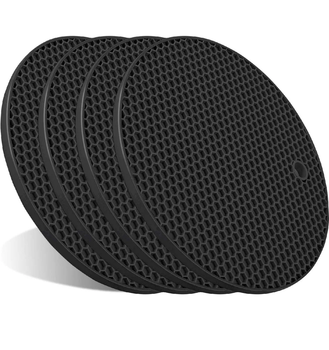 Four round black silicone trivets with honeycomb texture, each 7.2 inches wide and .25 inch thick