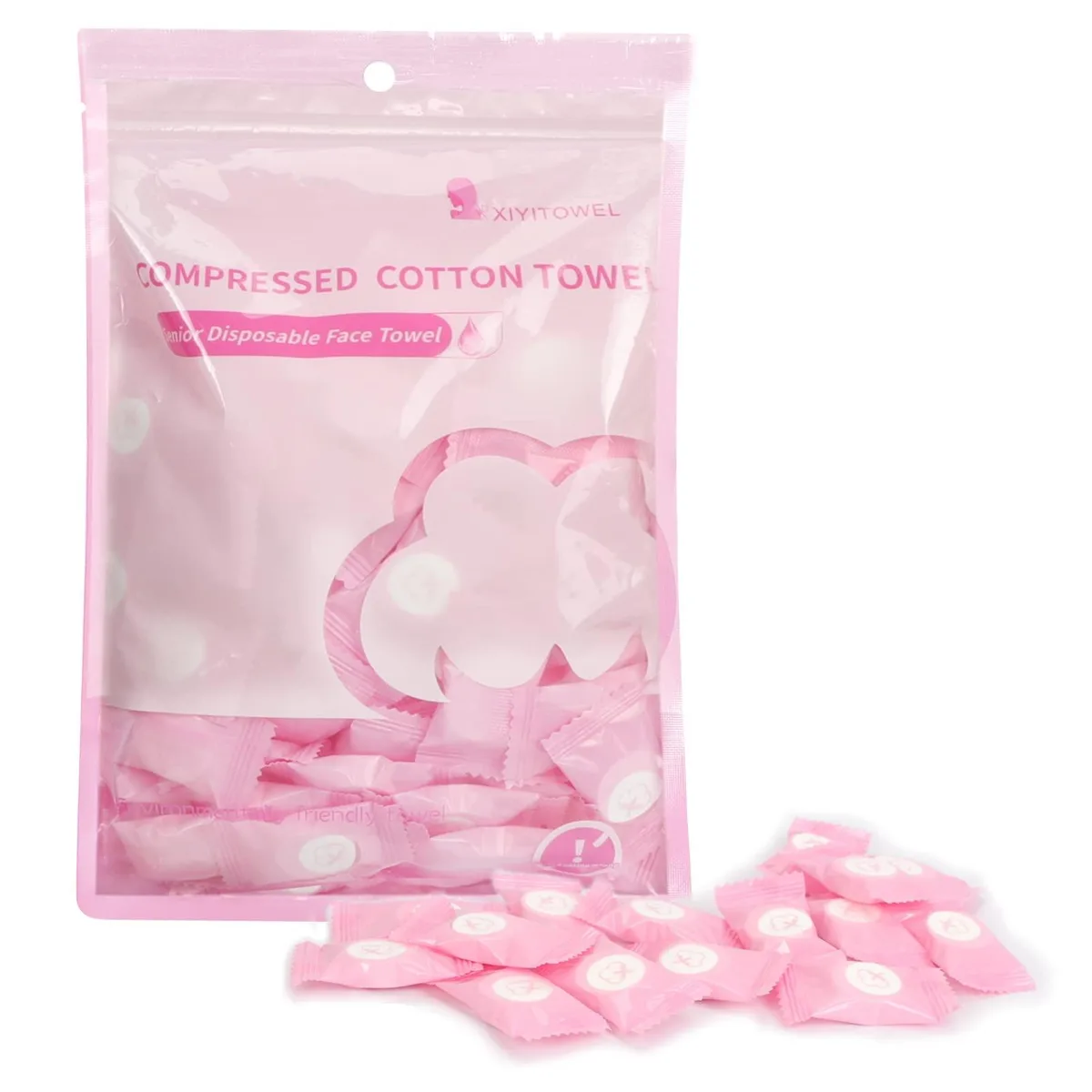 Cylindrical white container holding 100 pink compressed cotton towels