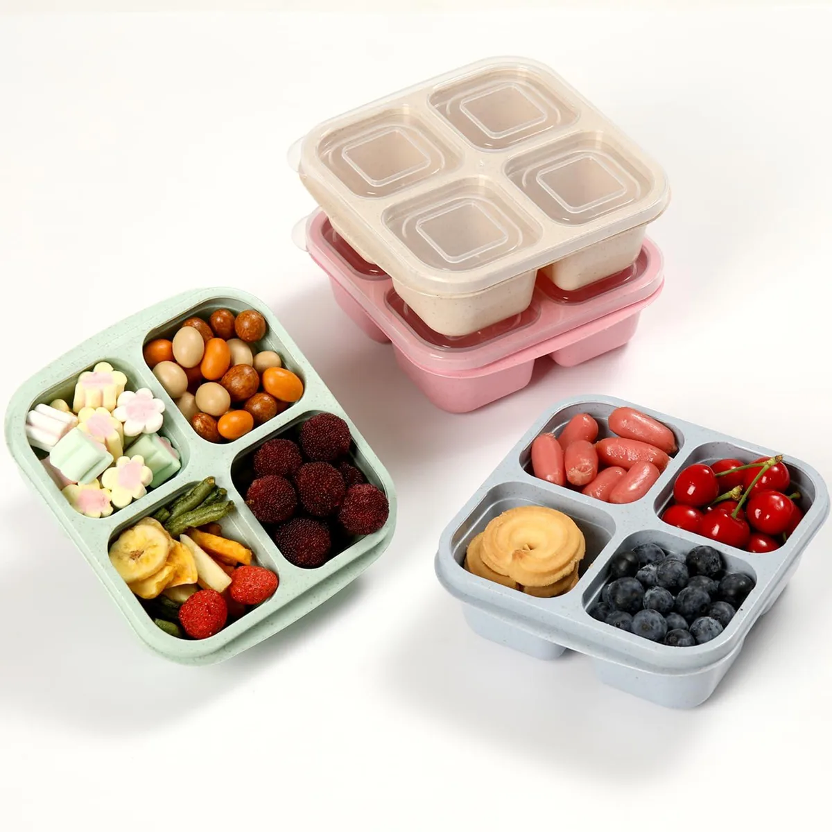 Four red silicone bento boxes, each with four compartments