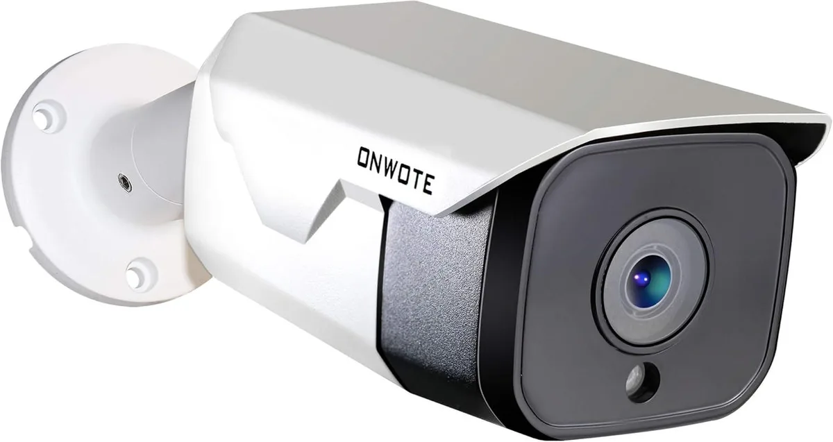 White bullet-shaped metal IP camera with sunshield and wall bracket