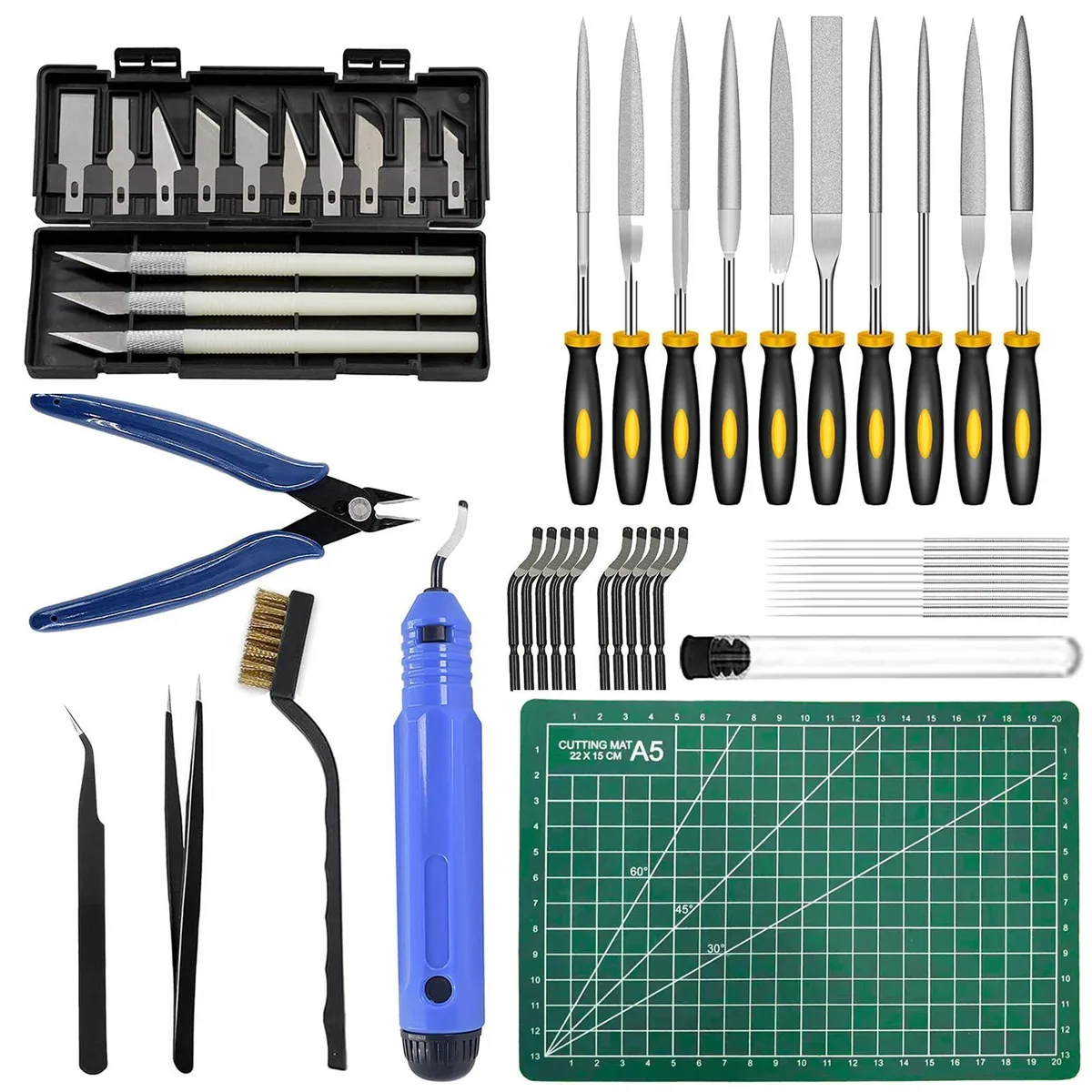 Open storage bag revealing brass brush, wire cutter, cutting mat, tweezers, needle files, craft knife and deburring tools