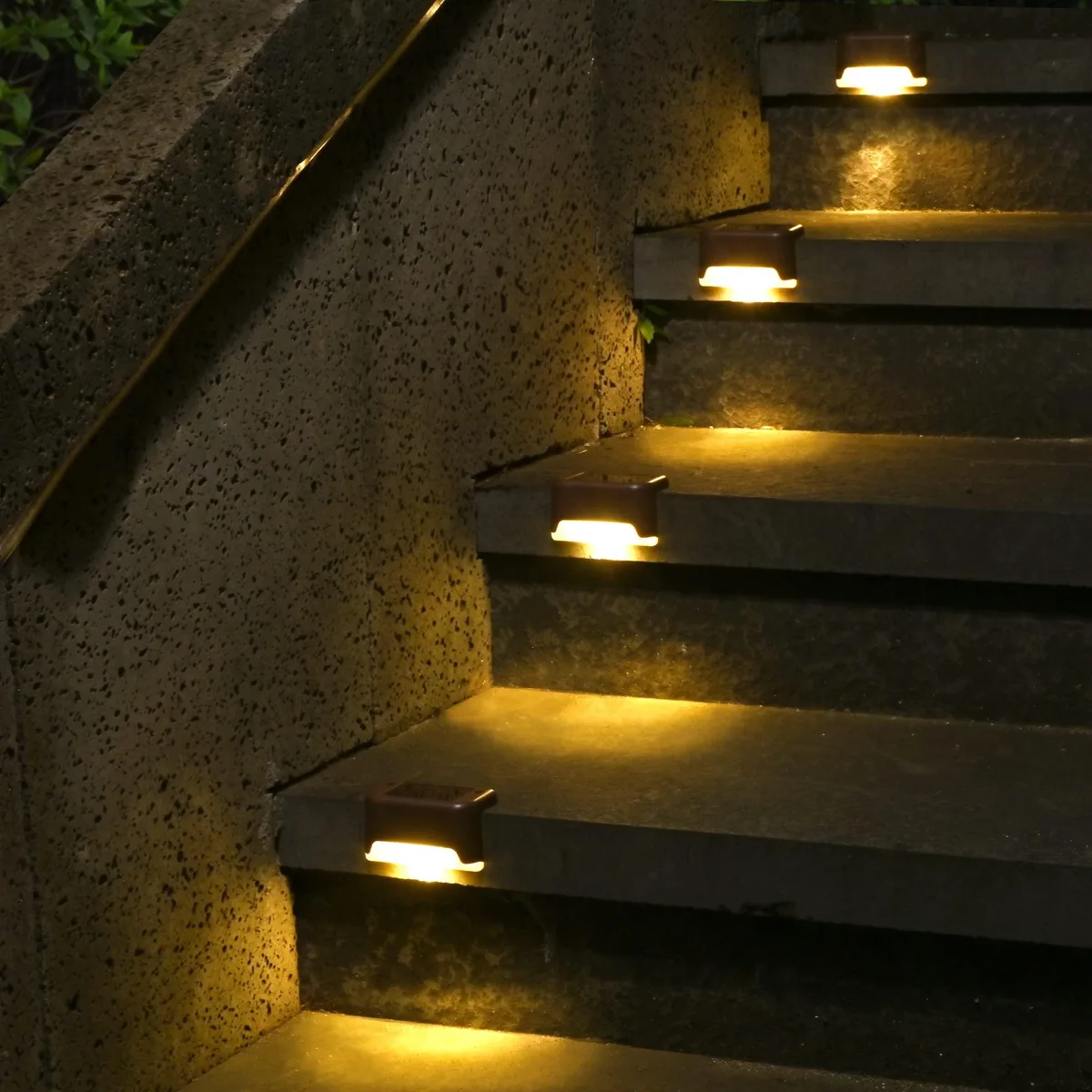 Twelve compact white acrylic solar lights with clear prismatic tops, rectangular low-profile design