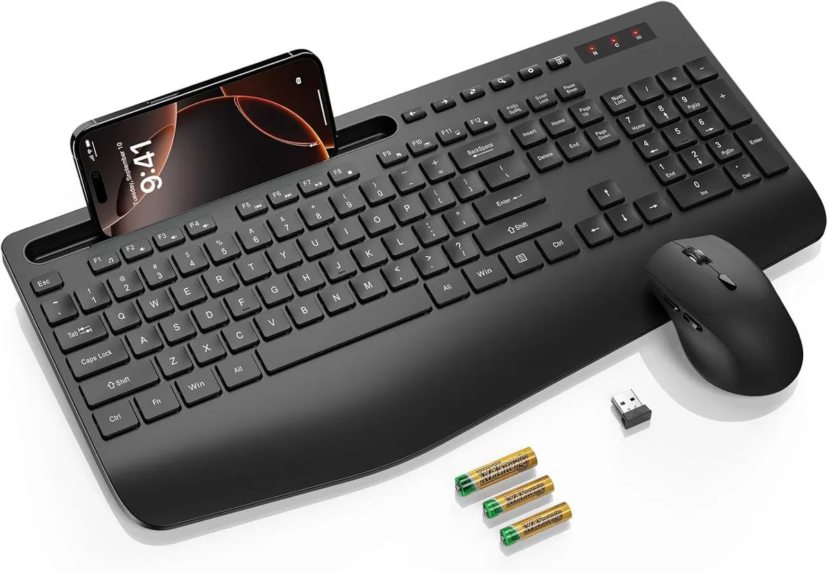 Black full-size wireless keyboard with integrated wrist rest, phone holder, and matching mouse