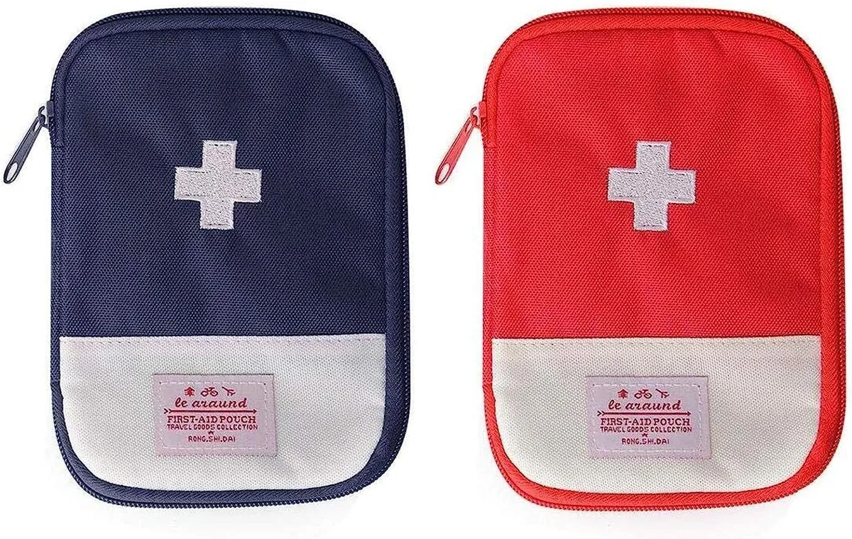 Two small rectangular pouches in blue and red oxford cloth with zipper closure and cross symbol