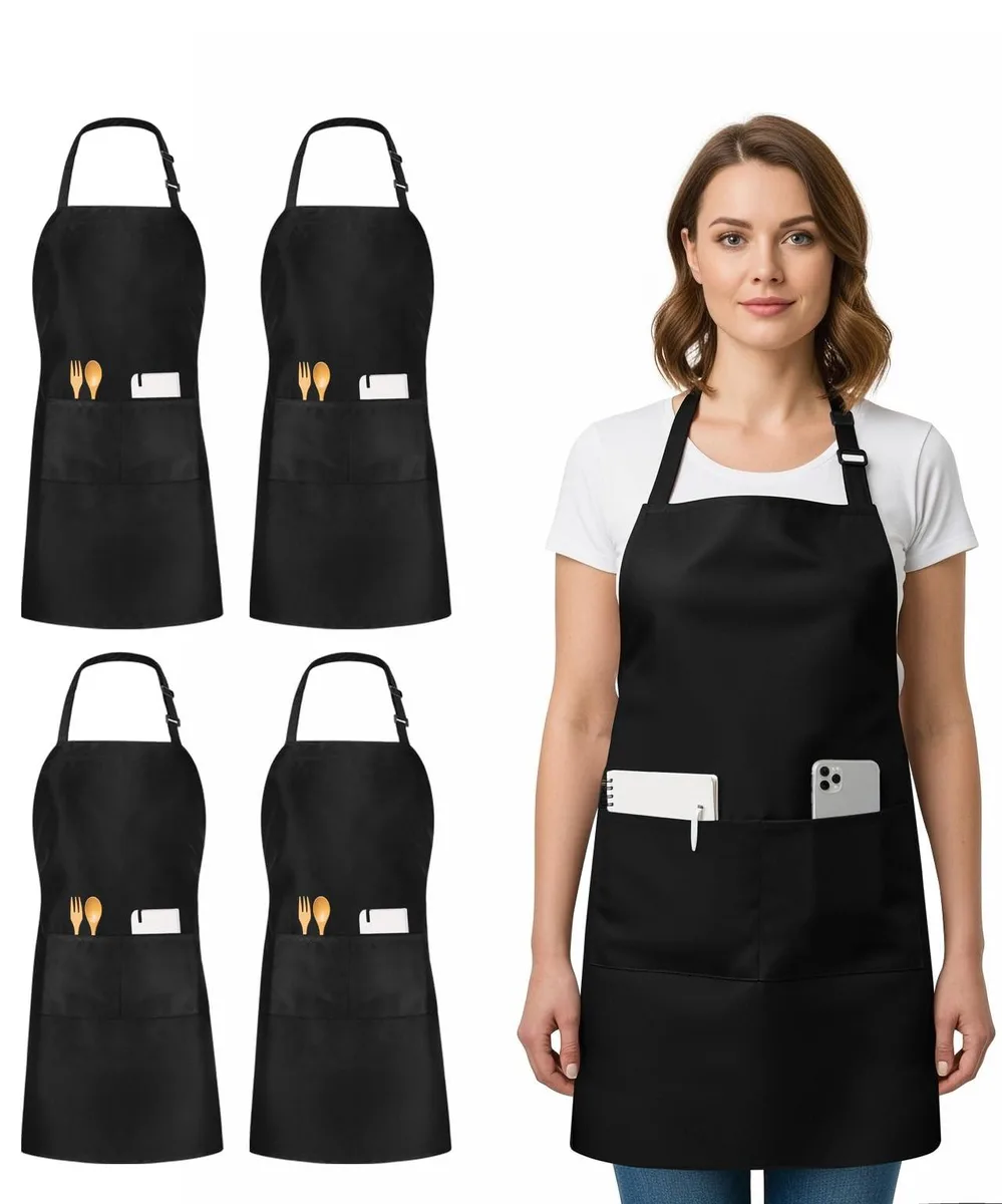 Four black bib aprons with adjustable neck loops and two front pockets each