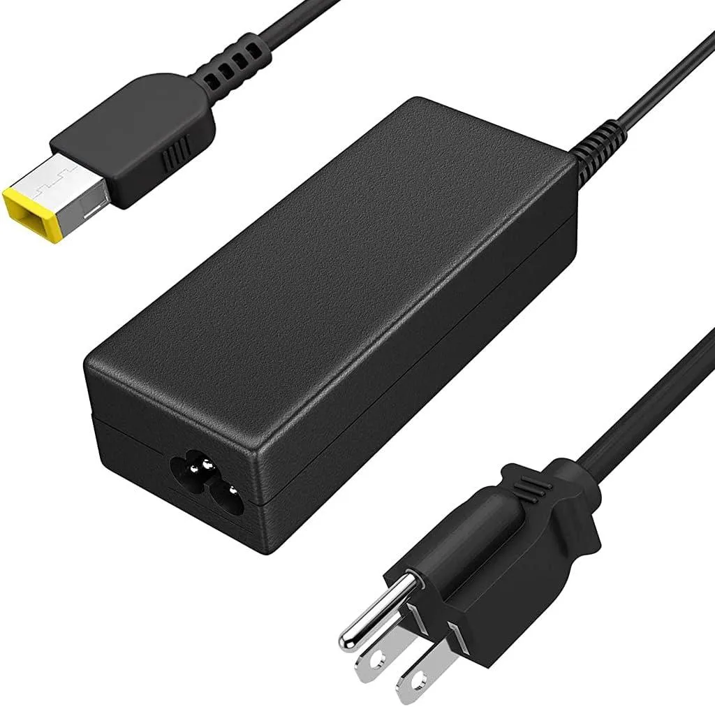 Black rectangular AC adapter with yellow USB tip connector and detachable power cord