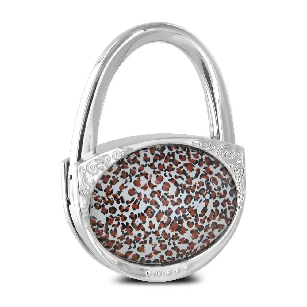 Folding purse hook with leopard insert, chrome finish and faceted gem cover
