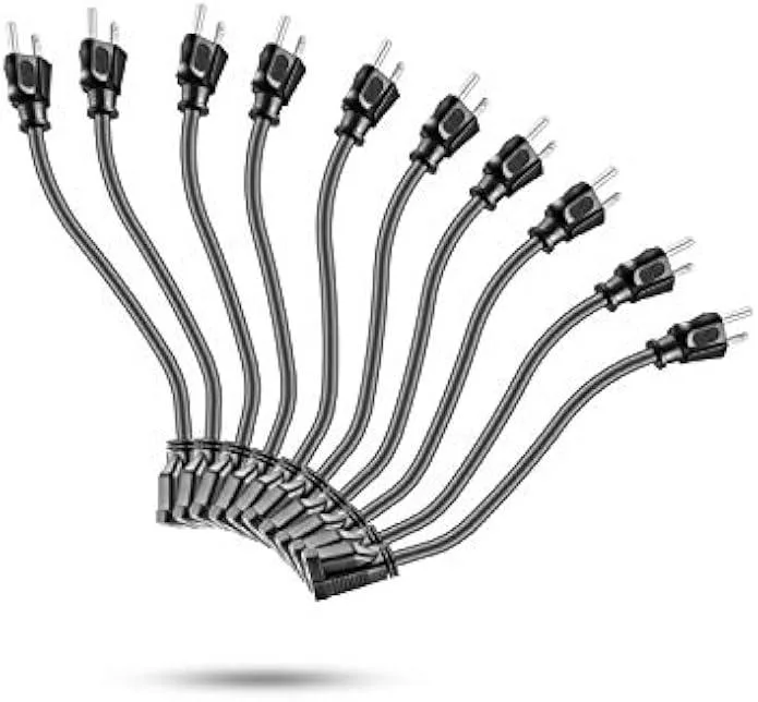 Ten black three-prong power extension cords coiled together