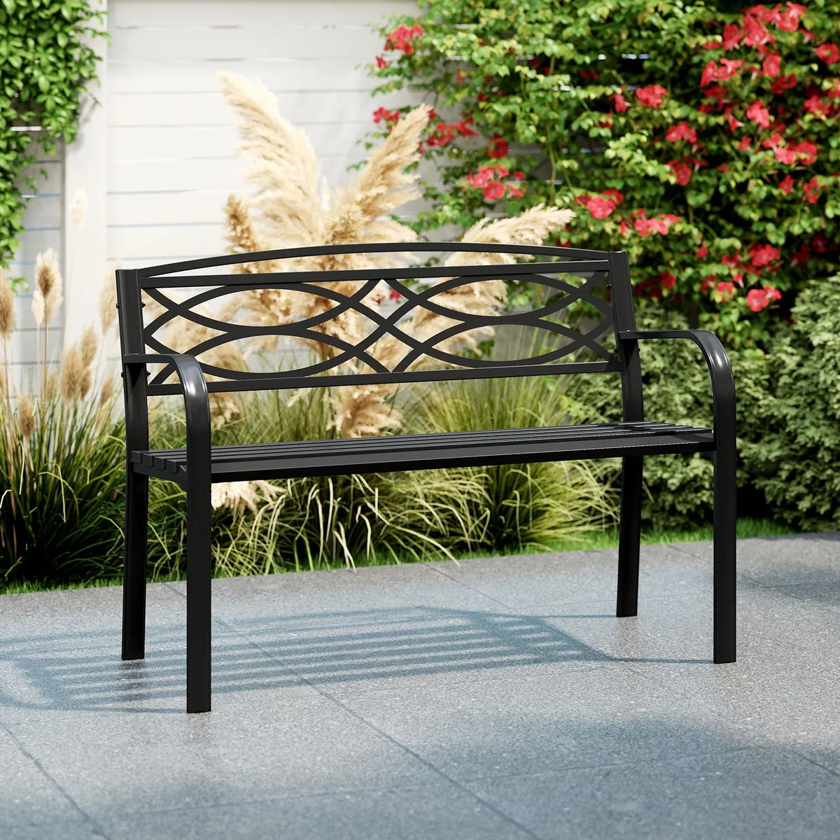 Black metal garden bench with curved armrests and contoured seat