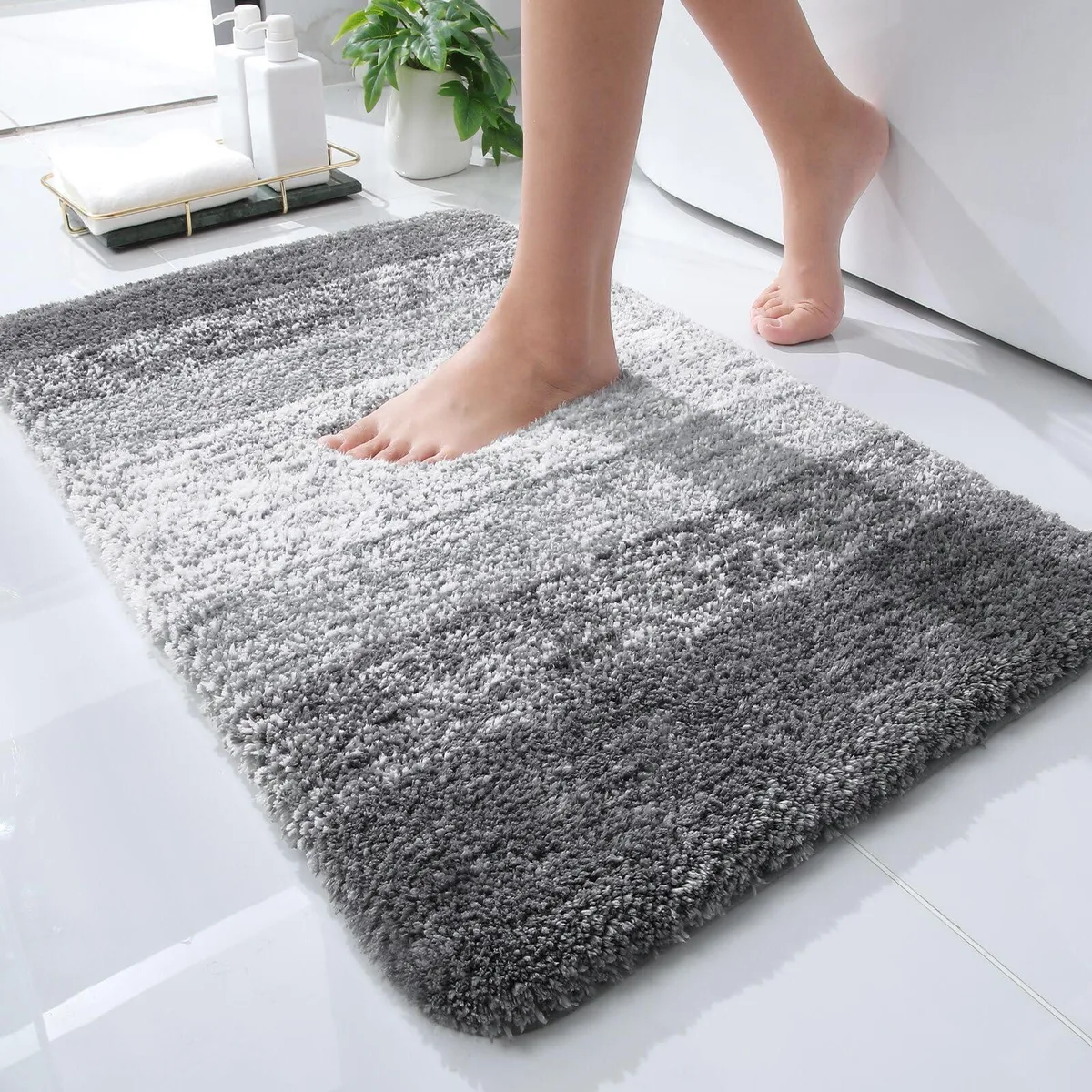 Grey microfiber bath mat, 24 by 16 inches, plush pile with rubber backing