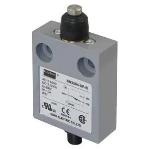 Small rectangular switch with vertical plunger actuator and sealed boot