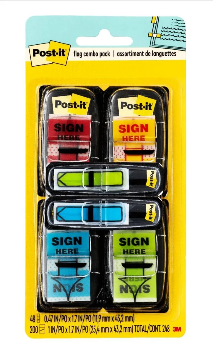Four small plastic dispensers in red blue yellow green each holding sign here flags