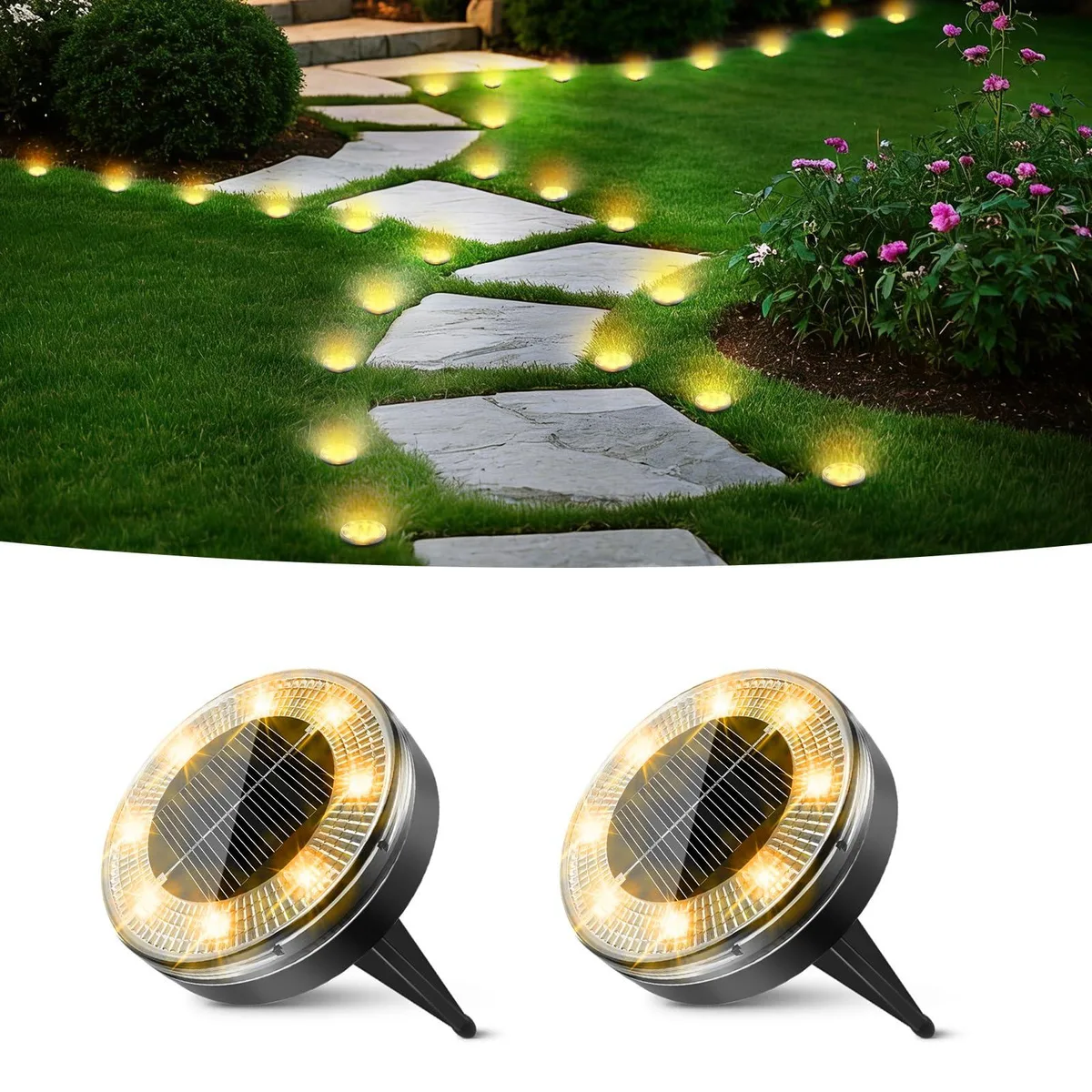 Two flat round solar ground lights, warm white LEDs, dark plastic finish