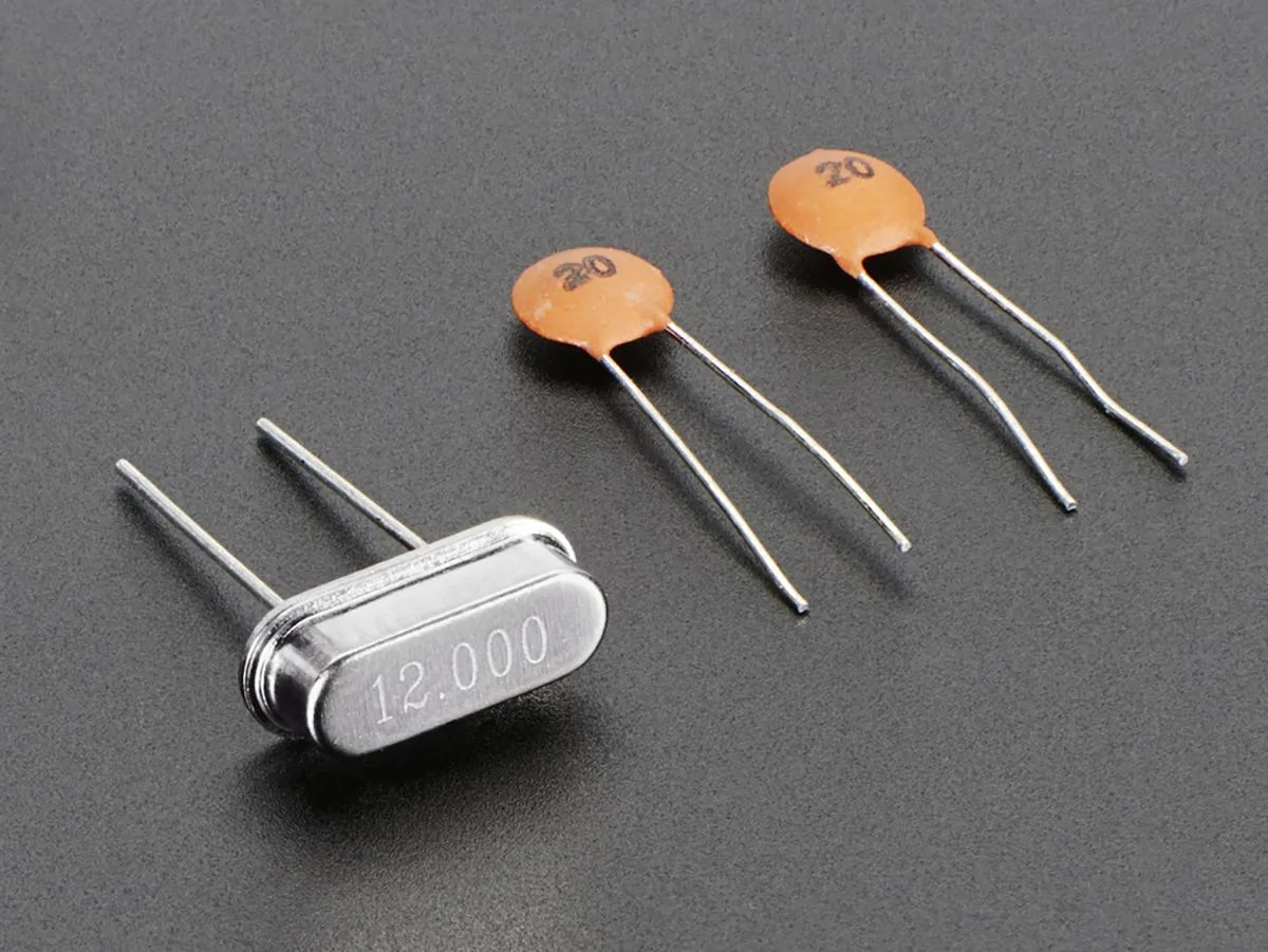 Adafruit Adafruit 12 MHz crystal with 20pF capacitors, HC49/US package — product photo