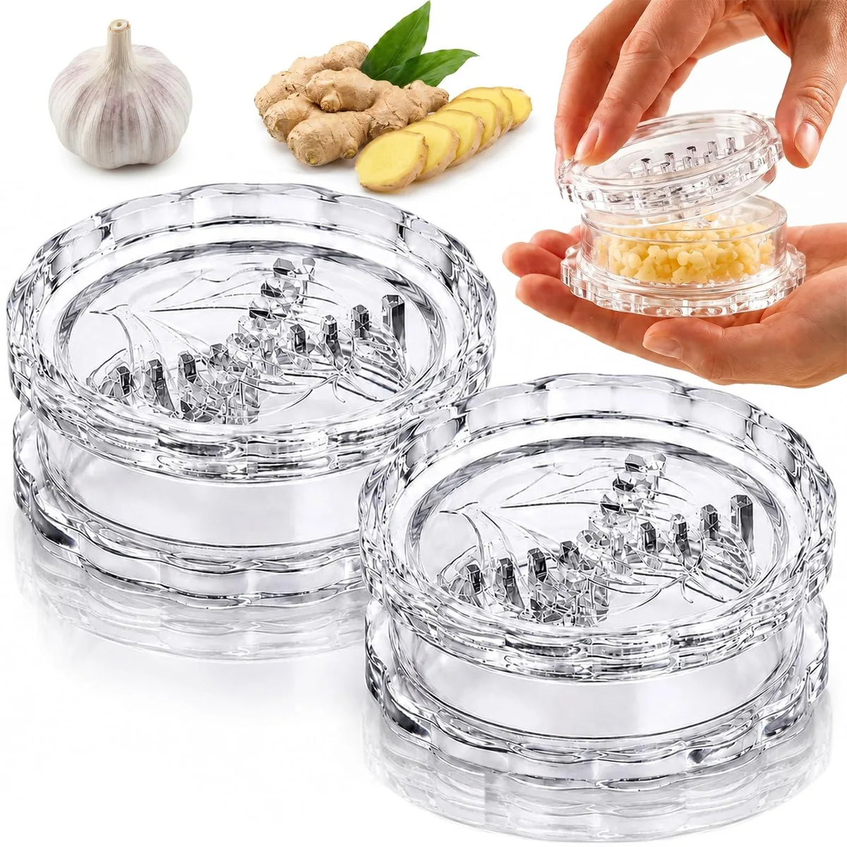 Two white plastic garlic twisters, transparent cylindrical bodies with twisting lids, handheld size