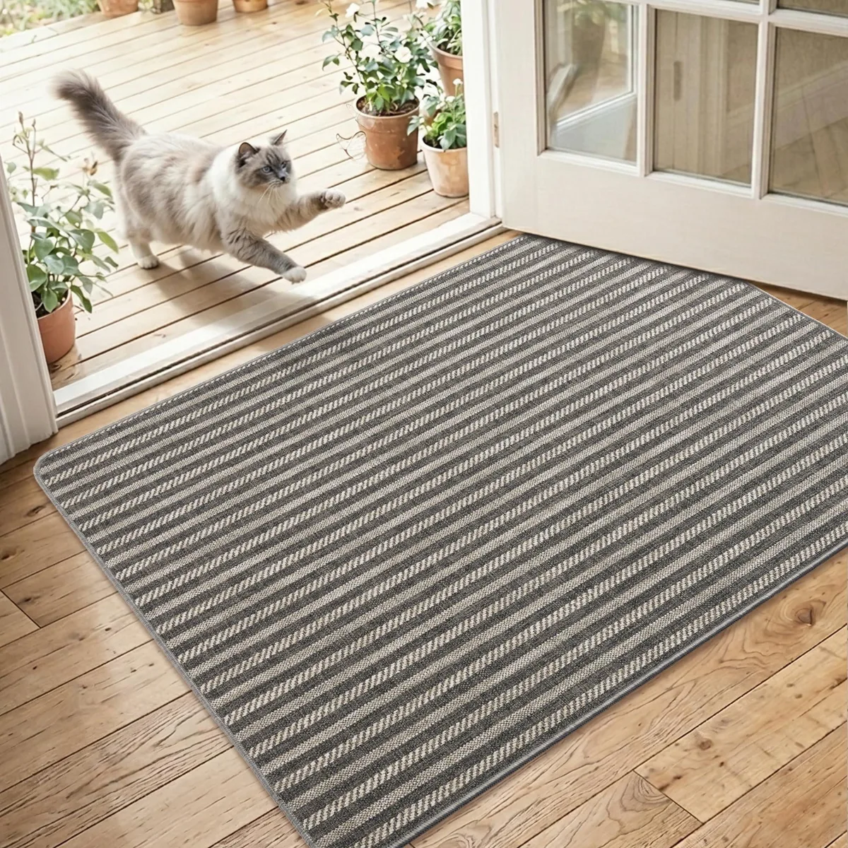 Grey woven indoor door mat with rubber backing, low profile, 2 by 3 feet