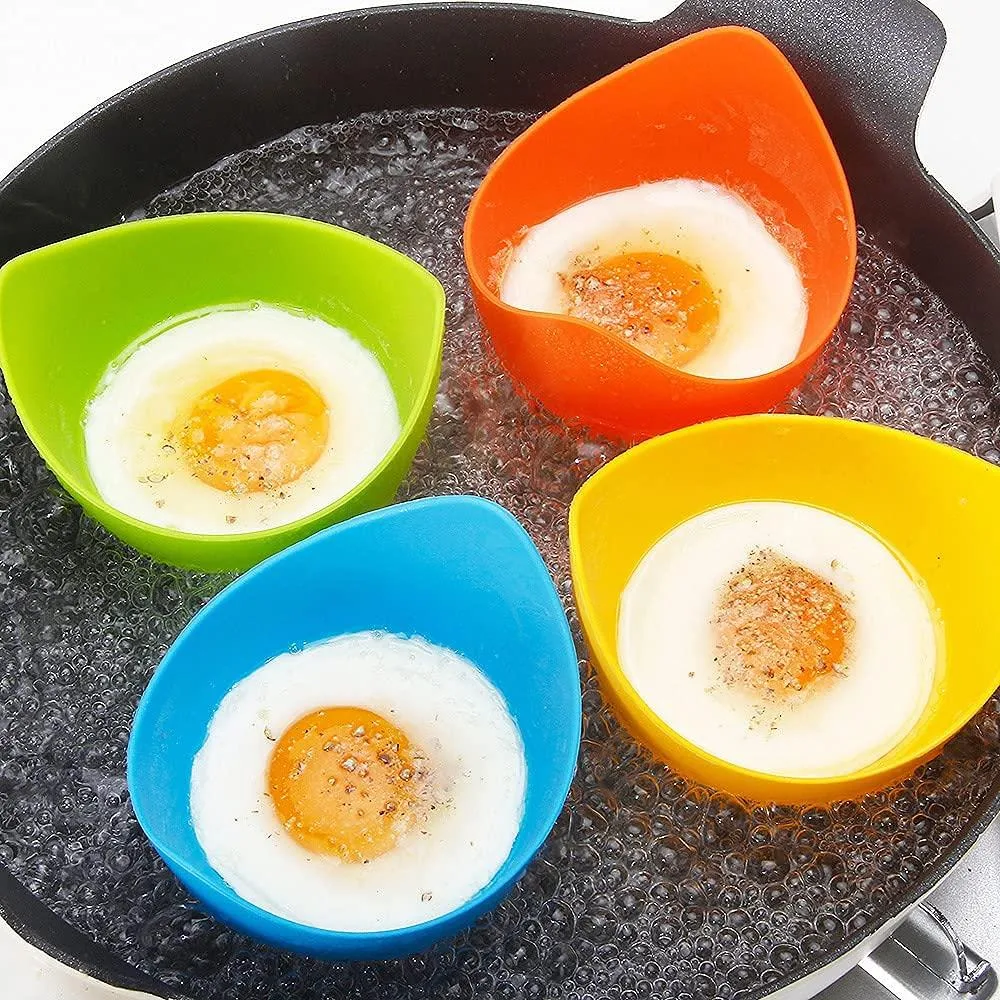 Four blue silicone egg poacher cups with ring stands in a gift box