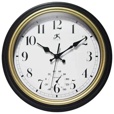 Black round clock with gold trim and thermometer