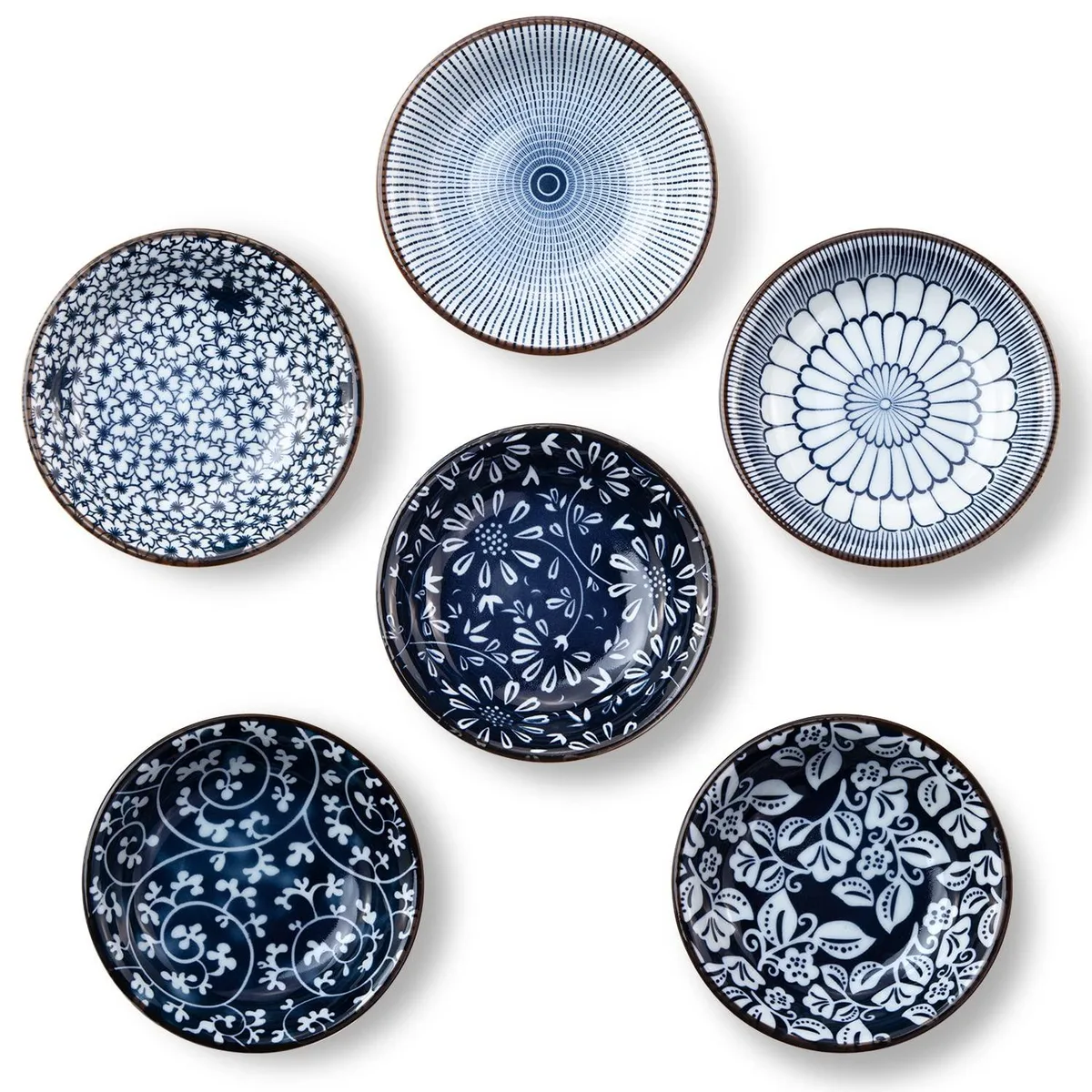Six small round ceramic bowls with blue and white vintage patterns stacked together