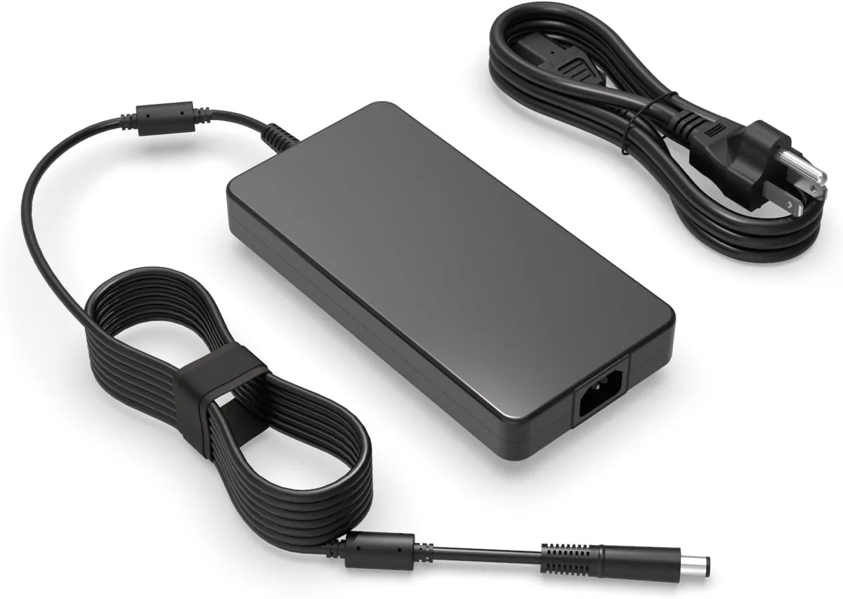 Black rectangular power brick with round connector and detachable mains lead
