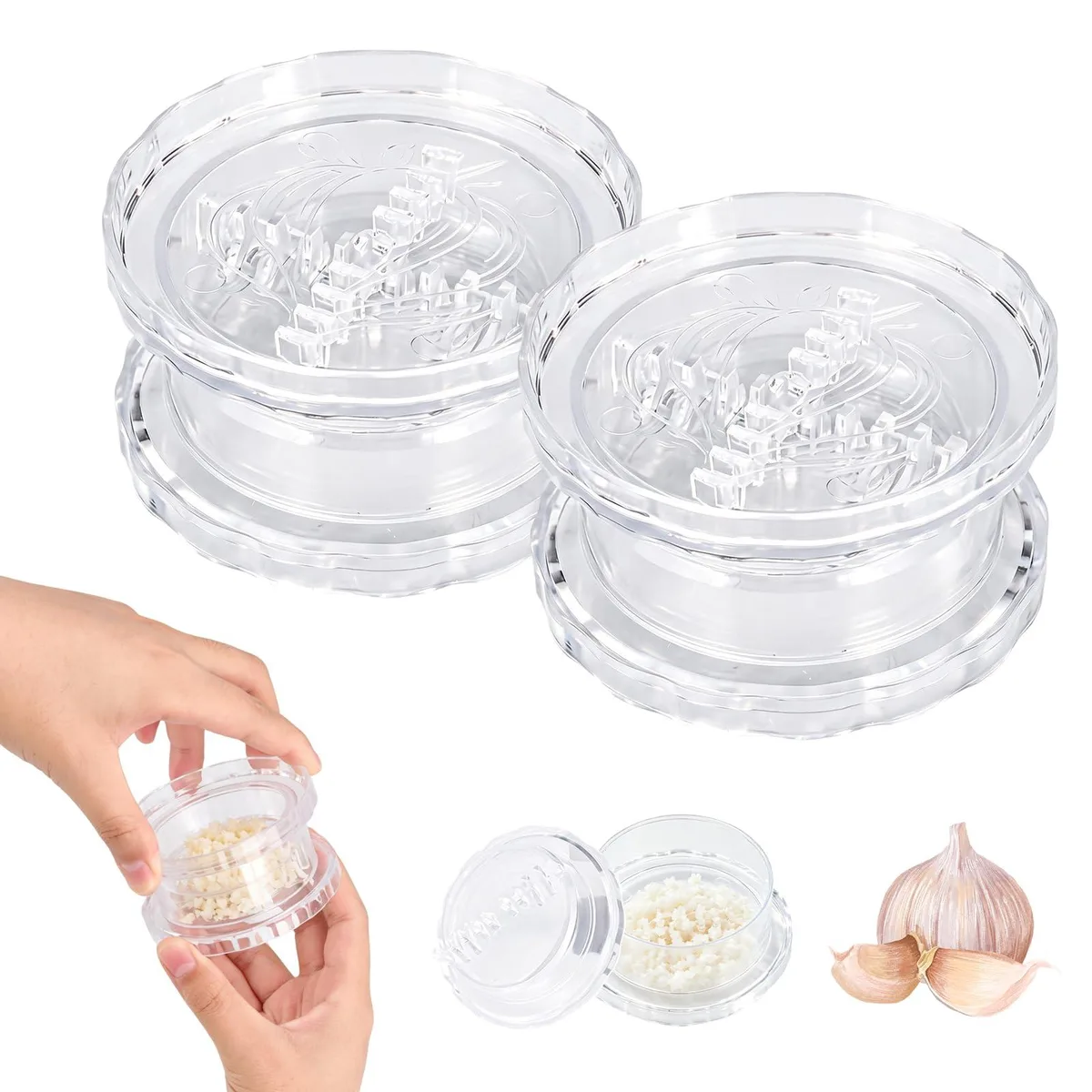 Two transparent plastic garlic twisters, cylindrical with twist lids, 3.9 x 12.3 x 19.7 cm