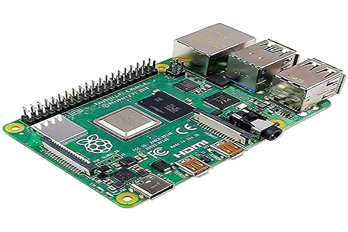 Green single-board computer with exposed circuits, USB and HDMI ports, silver processor, black RAM chip, white GPIO header pins