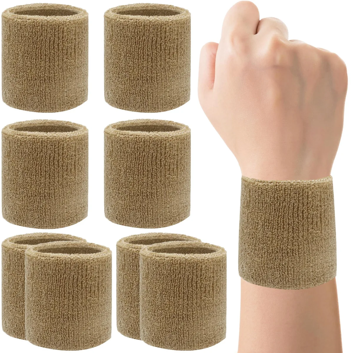 Eight light camel cotton wrist sweatbands stacked together