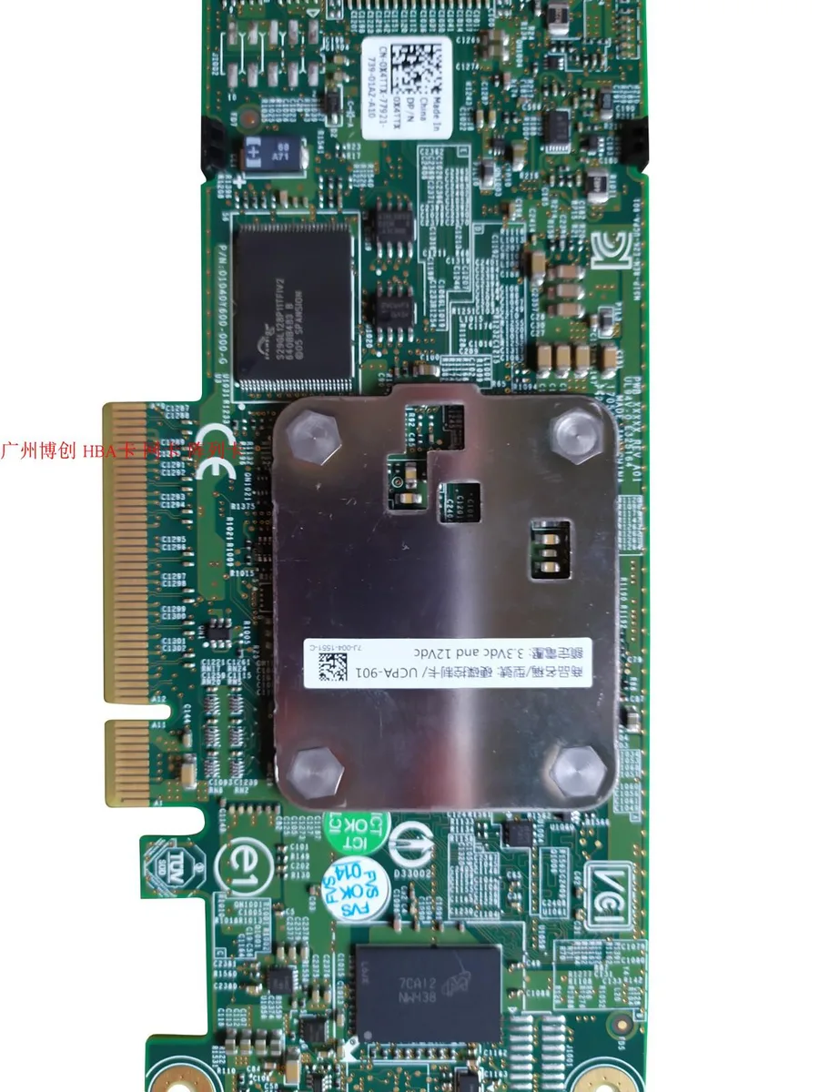 Green circuit board with silver SAS connectors and heatsink