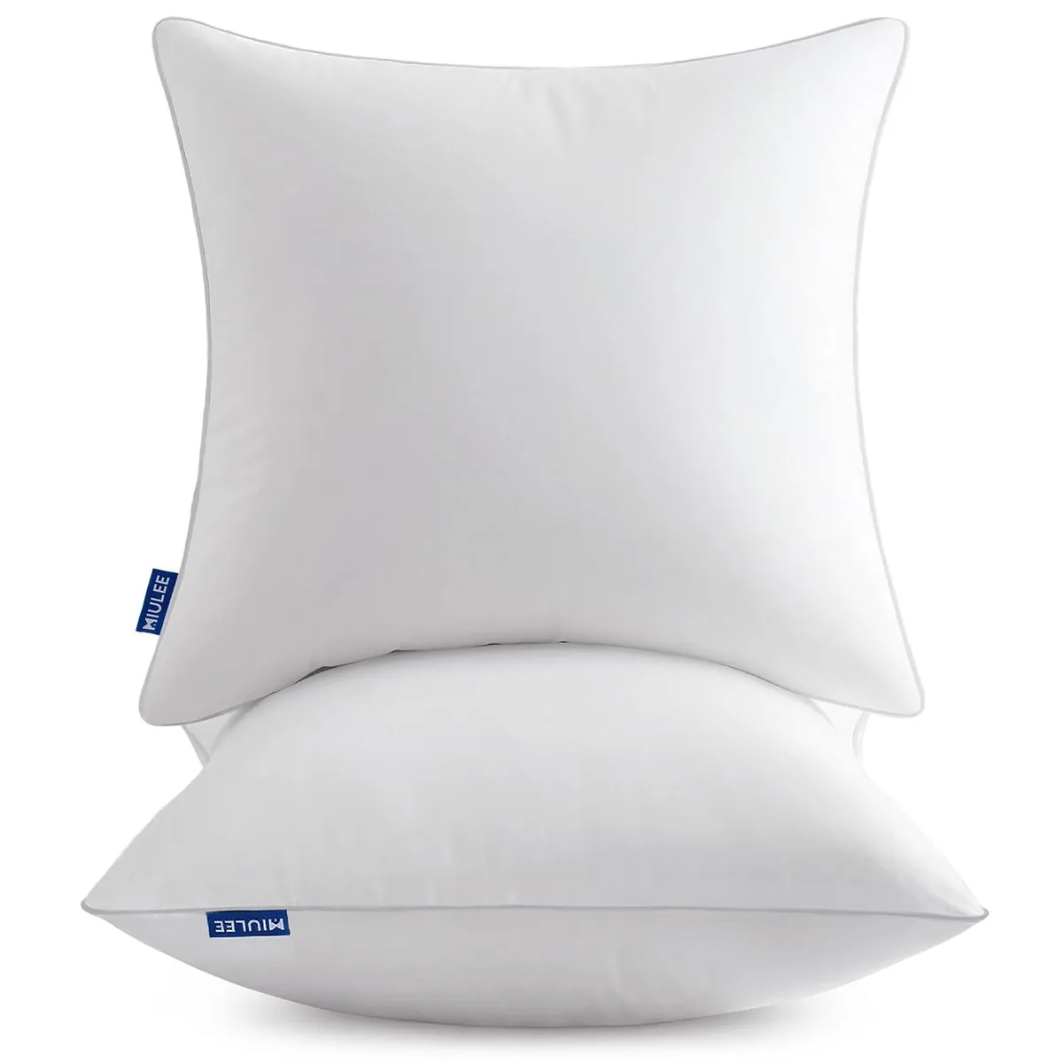 Two white square pillow inserts with cotton covers, vacuum-packed