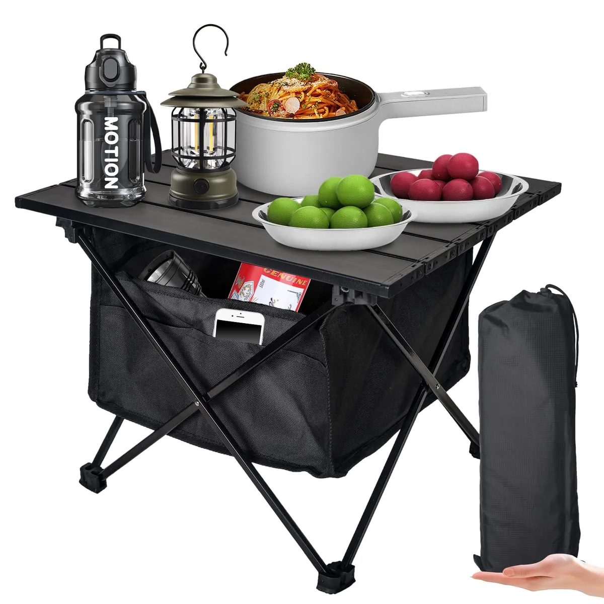 Black foldable aluminium side table with X-frame, collapsed in carry bag