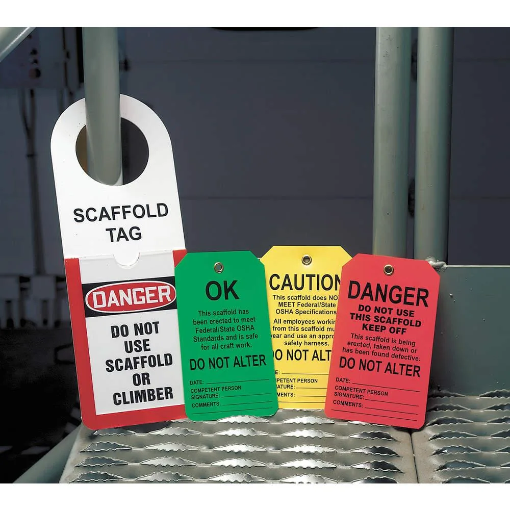 Pack of 25 yellow plastic caution tags with brass grommets
