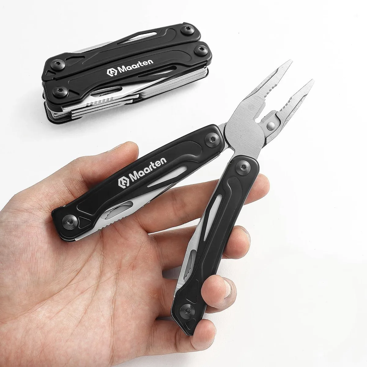 Folding stainless-steel multi-tool pliers, black finish, pocket clip and nylon sheath