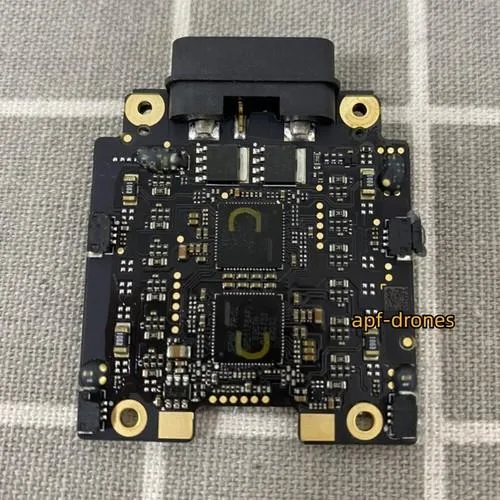 Small black rectangular circuit board with soldered components and mounting holes