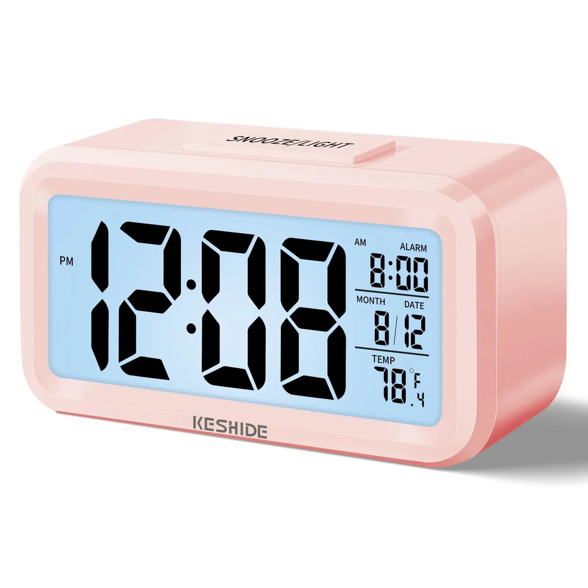 Pink rectangular LCD alarm clock with top light and snooze buttons, 6.7 by 1.5 by 3.0 inches