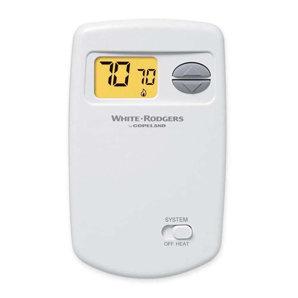 Twelve white rectangular wall thermostats with digital displays in a bulk pack