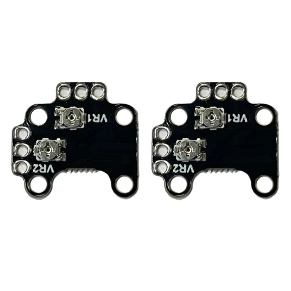 Two small green circuit boards with gold contacts and black components