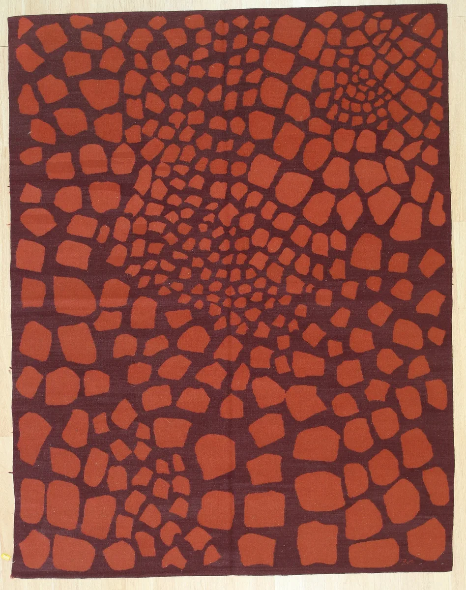 Handwoven flat-weave wool rug in orange with kilim pattern, surged edges