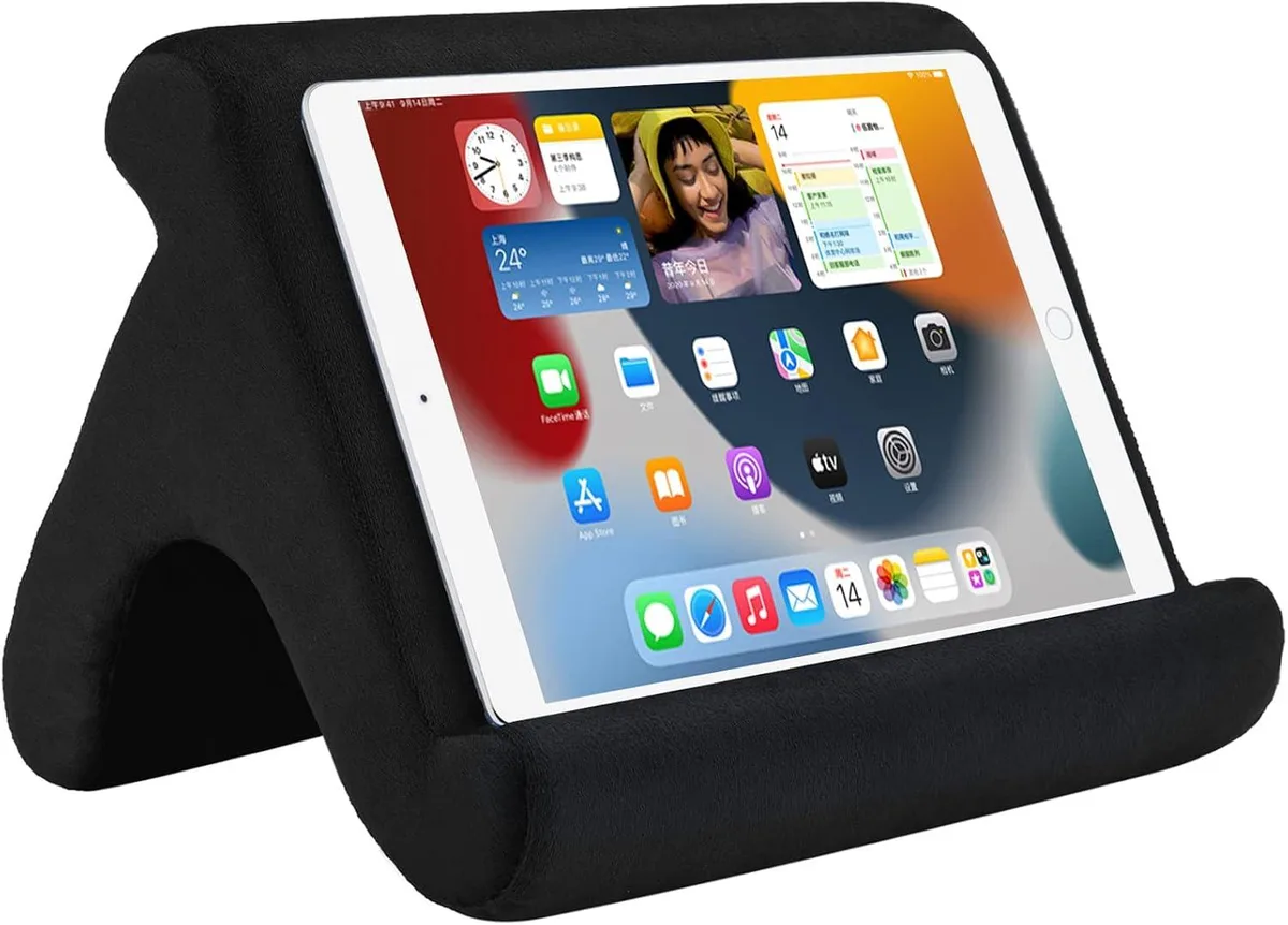 Black pillow stand with three angled grooves for tablets and phones