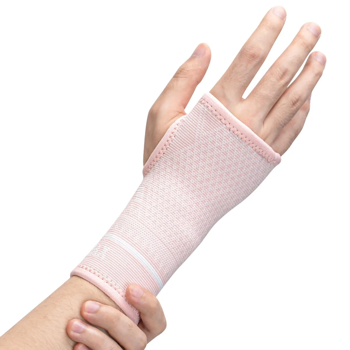A pair of pink wrist compression sleeves with copper fabric, size M
