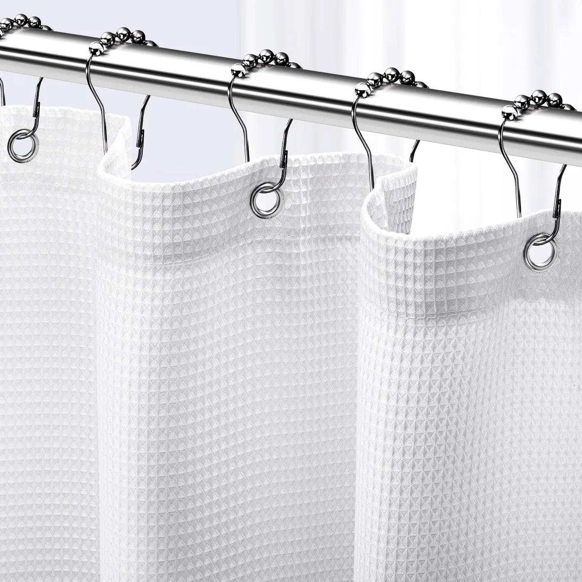 White polyester shower curtain with waffle texture and metal grommets, 72 by 72 inches