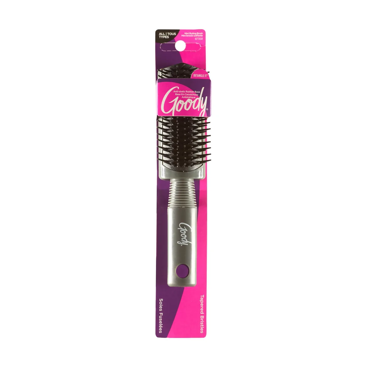 Compact hair brush with rubberised base and tapered bristles